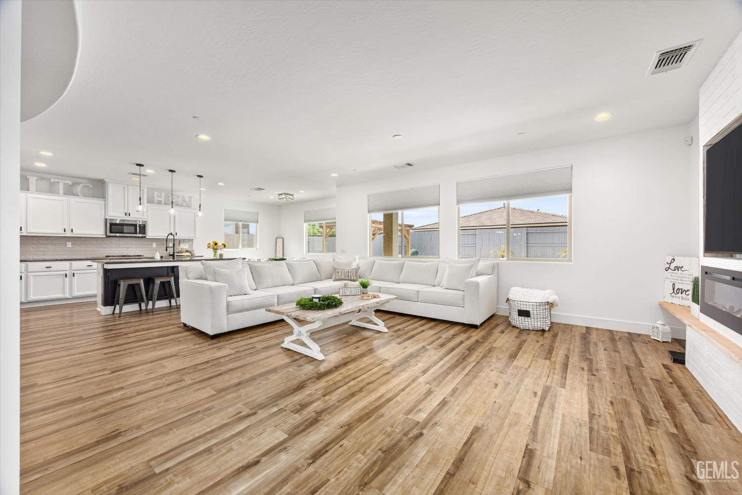 Undisclosed Address Bakersfield, CA 93314 - Photo 6 of 43 a living room with furniture and a wooden floor