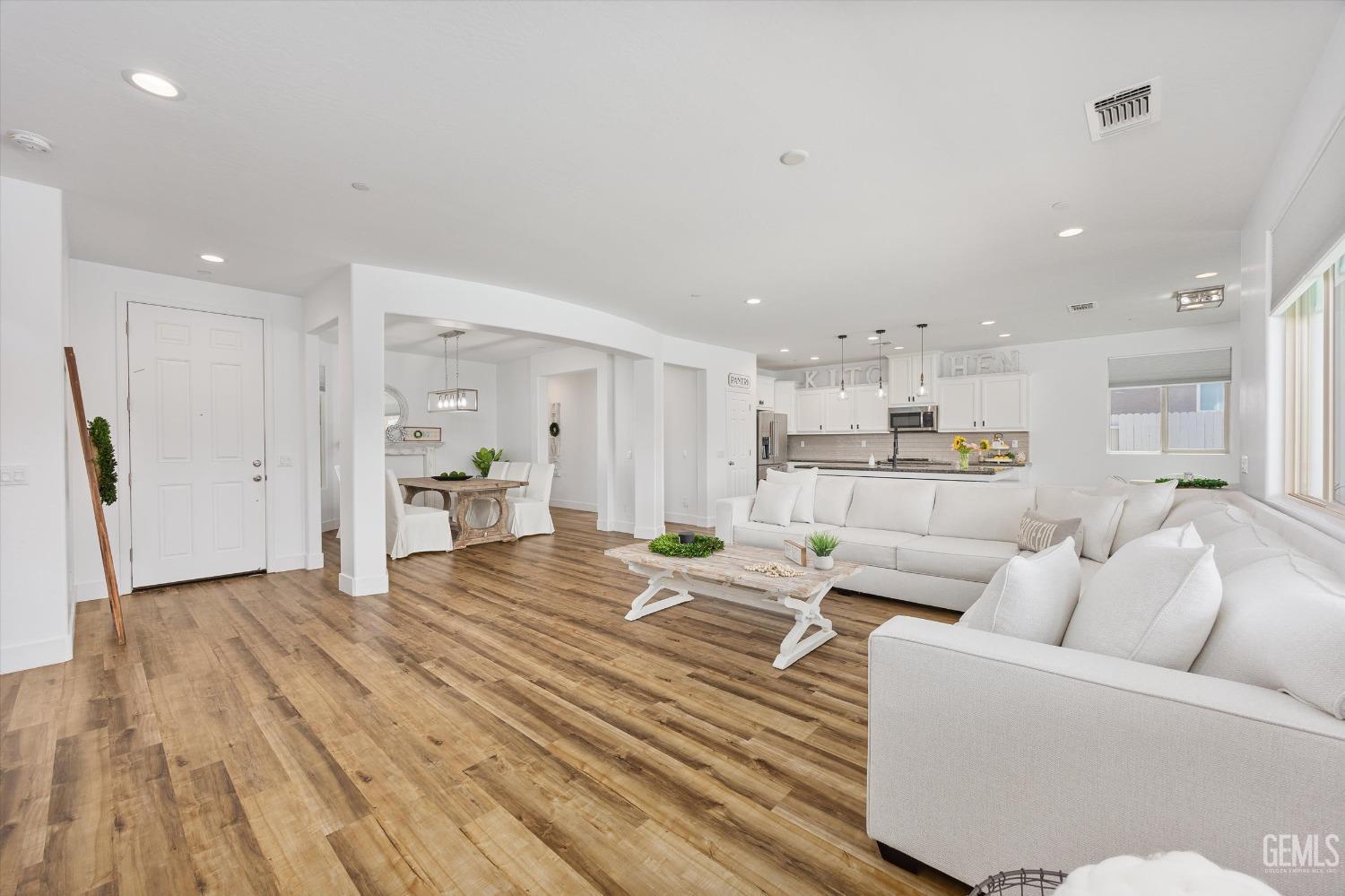 Undisclosed Address Bakersfield, CA 93314 - Photo 7 of 43 a living room with furniture and kitchen view