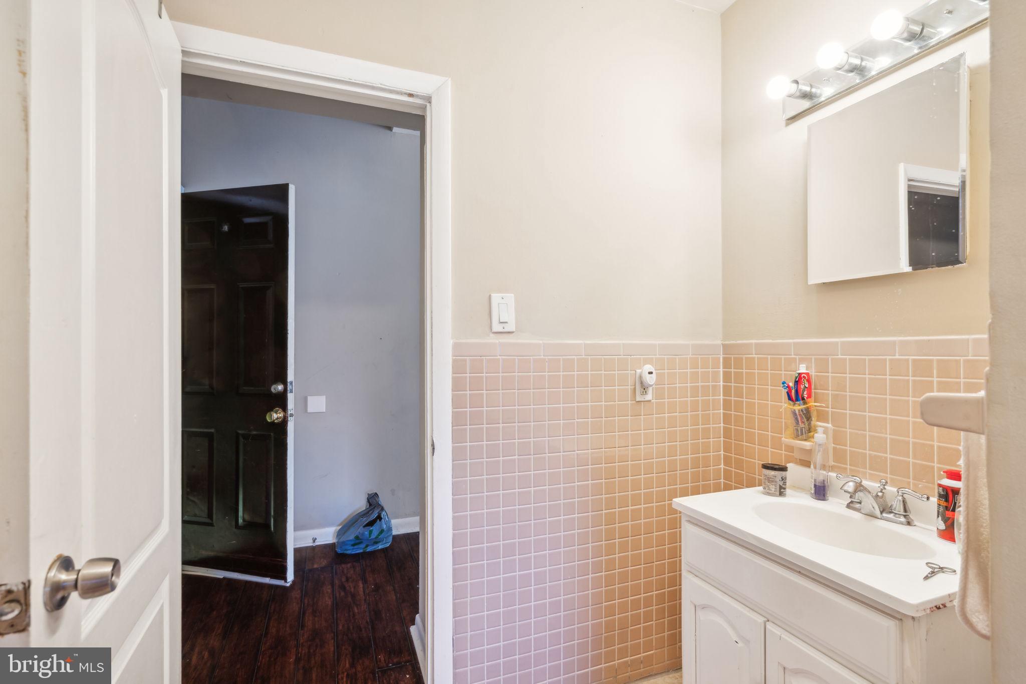 4036 Spring Garden Street Philadelphia, PA 19104 - Photo 19 of 46 a bathroom with a sink toilet and vanity