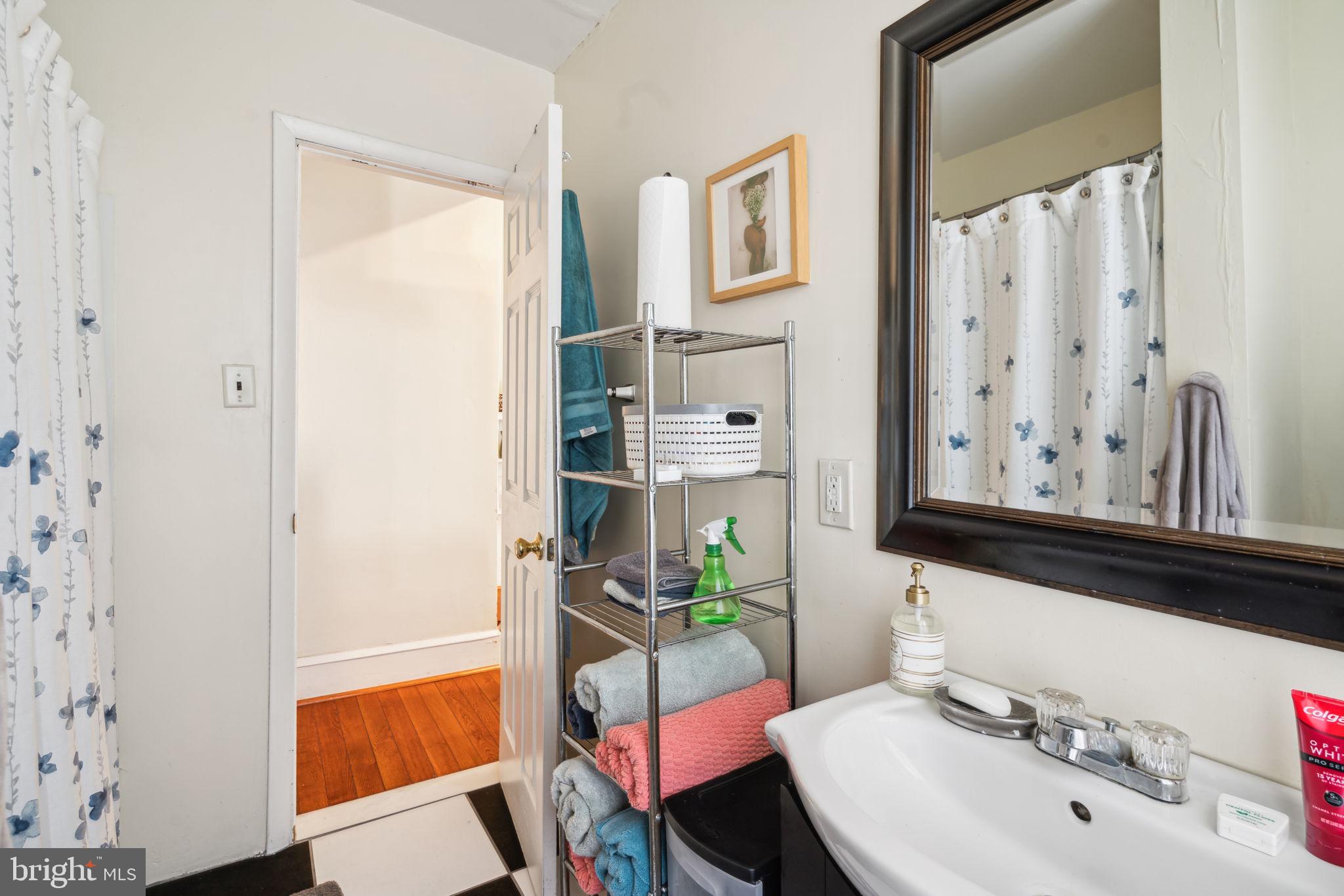 4036 Spring Garden Street Philadelphia, PA 19104 - Photo 35 of 46 a bathroom with a sink and a mirror