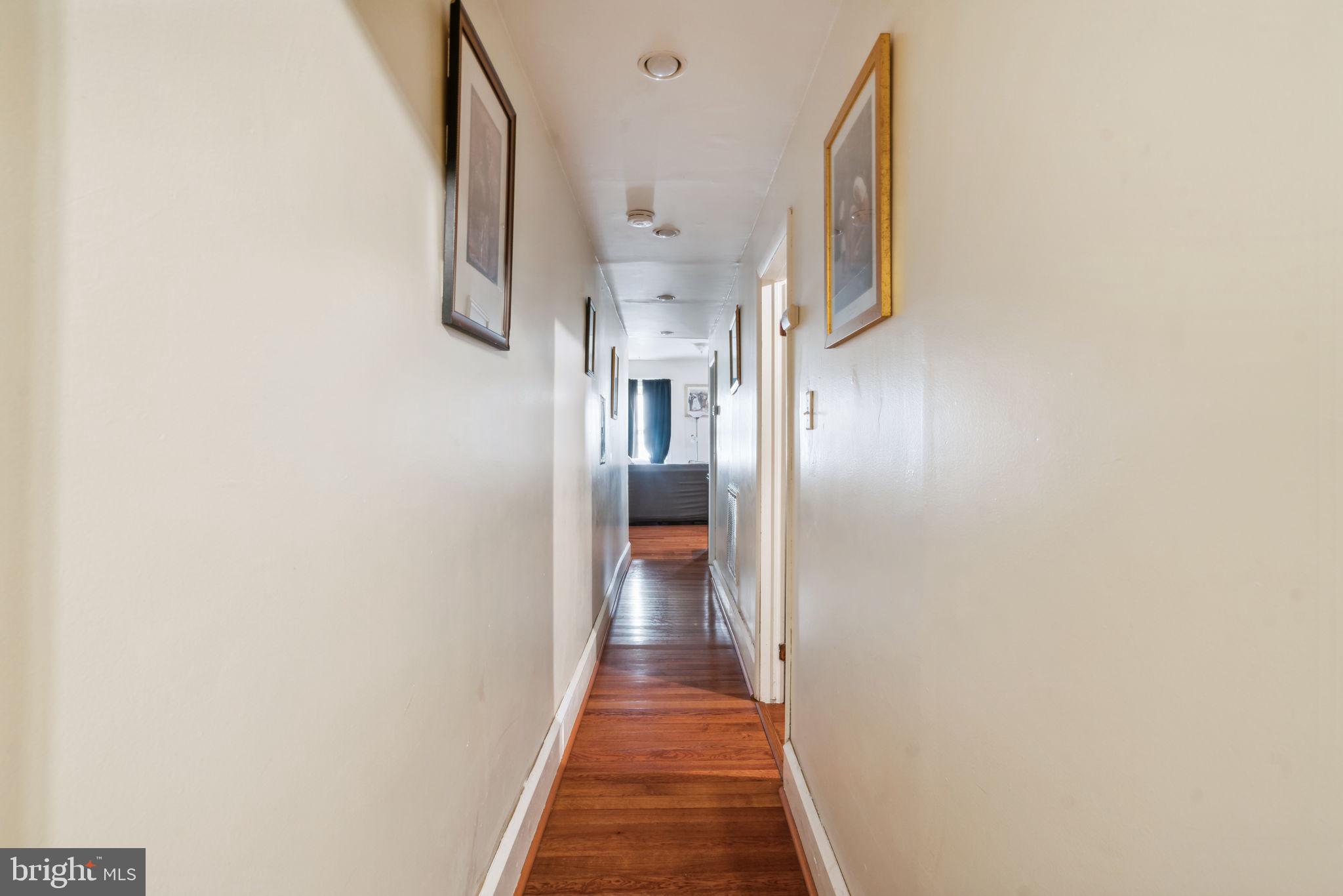 4036 Spring Garden Street Philadelphia, PA 19104 - Photo 38 of 46 a view of a hallway with wooden floor