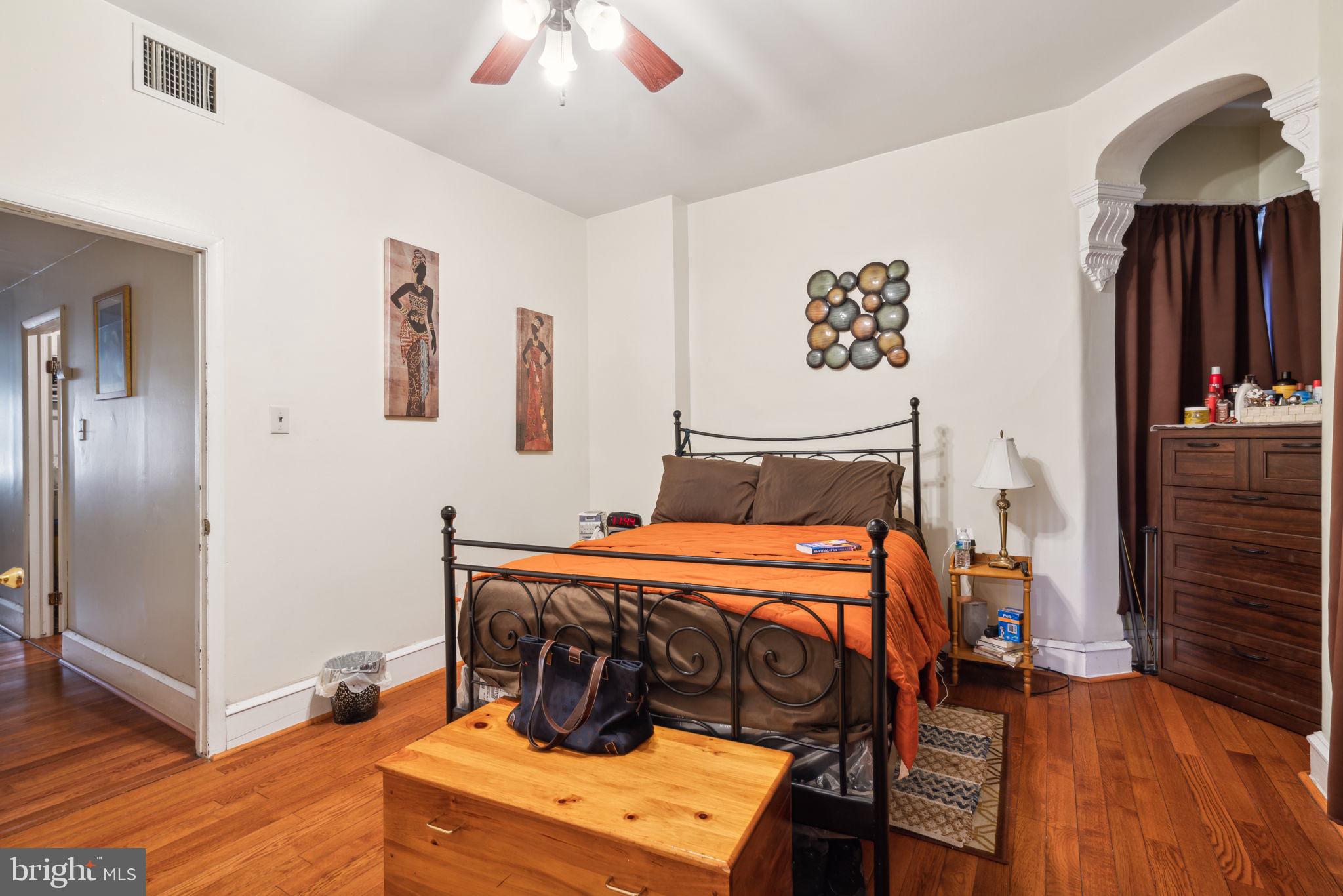 4036 Spring Garden Street Philadelphia, PA 19104 - Photo 40 of 46 a bedroom with a bed and wooden floor