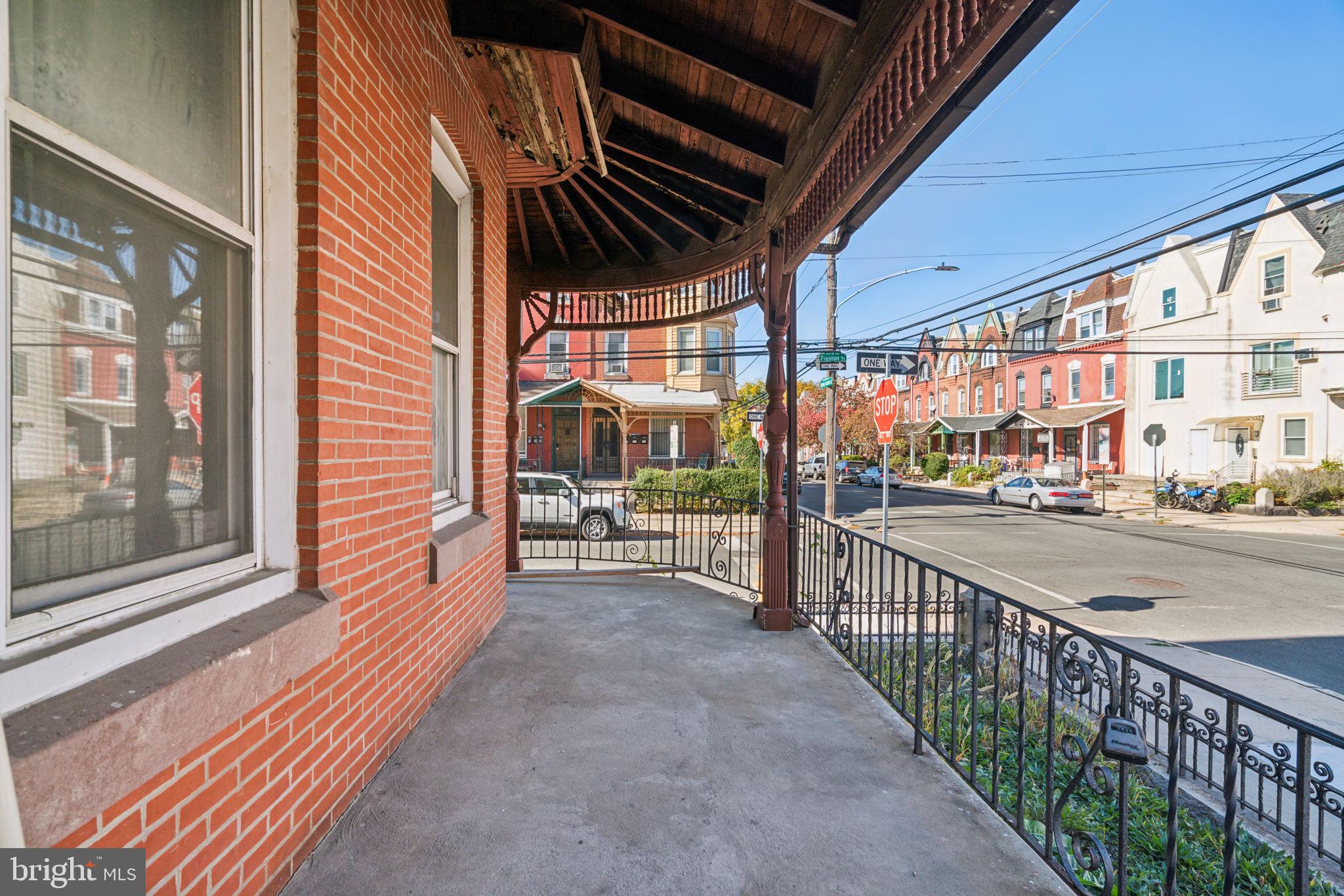 4036 Spring Garden Street Philadelphia, PA 19104 - Photo 43 of 46 a view of a porch with wooden floor and iron stairs