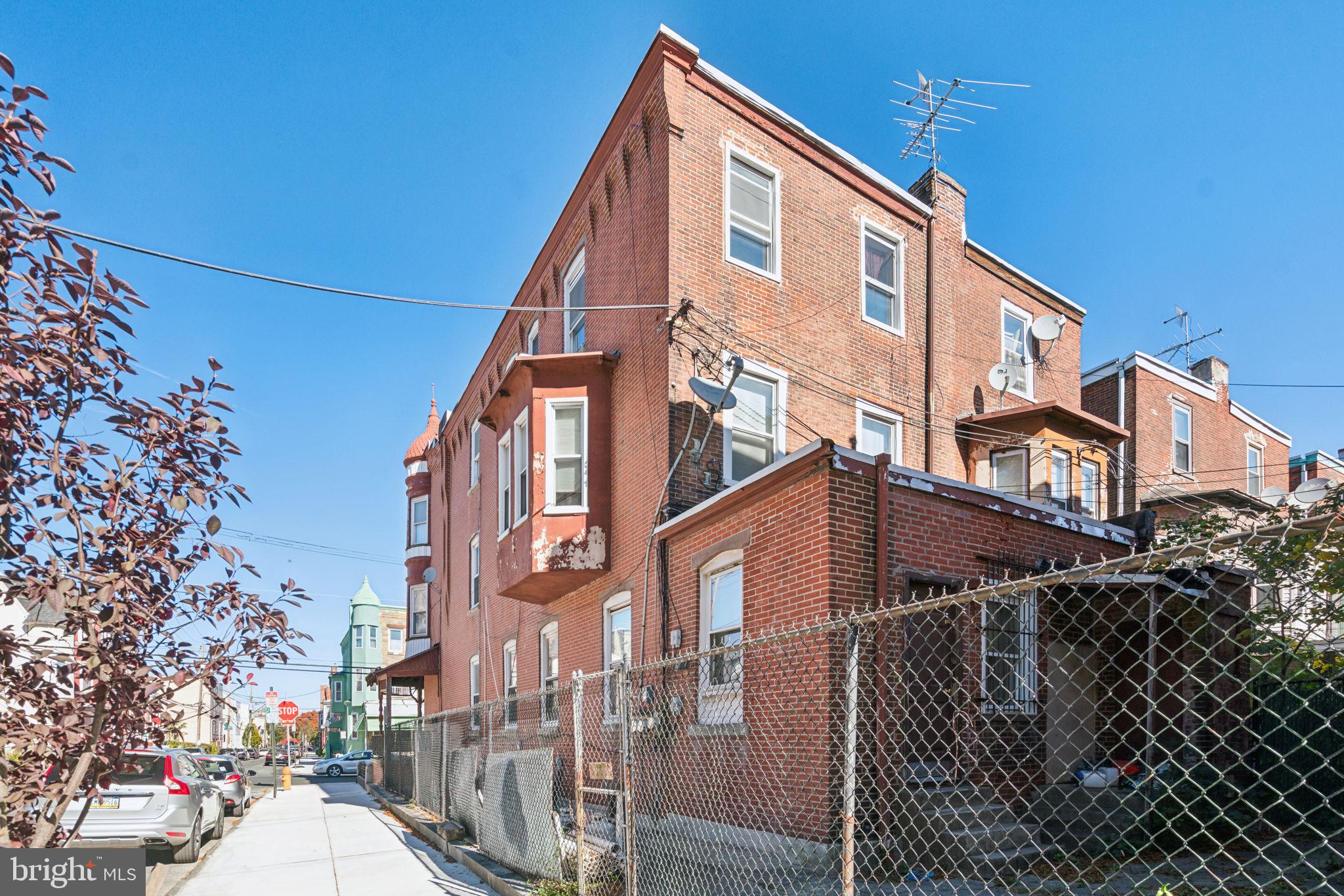4036 Spring Garden Street Philadelphia, PA 19104 - Photo 44 of 46 a front view of a house with a yard