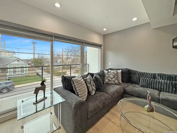 a living room with furniture and a large window