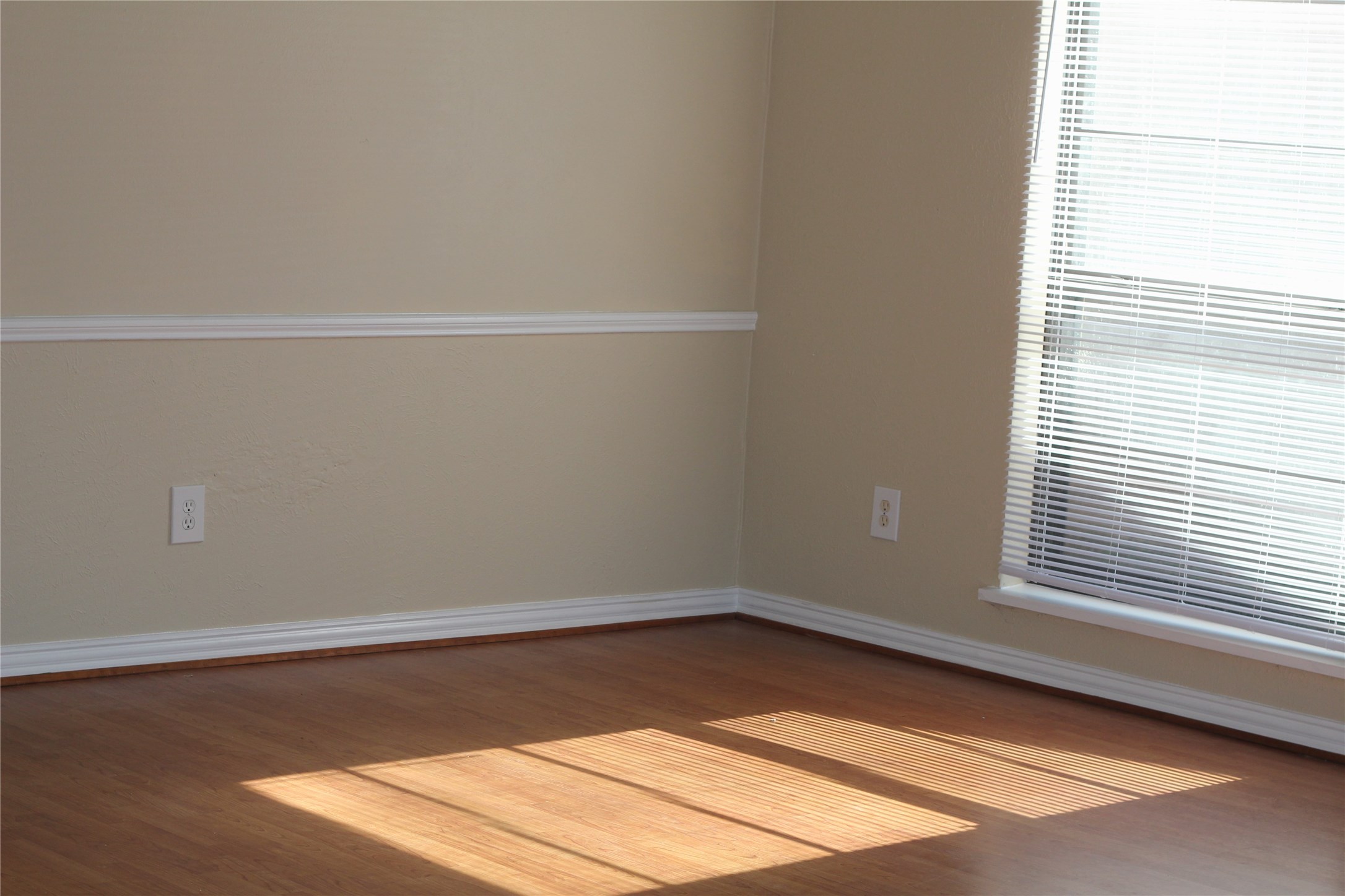 7207 Addicks Clodine Road Houston, TX 77083 - Photo 9 of 30 a view of a room that has wooden floor and more windows