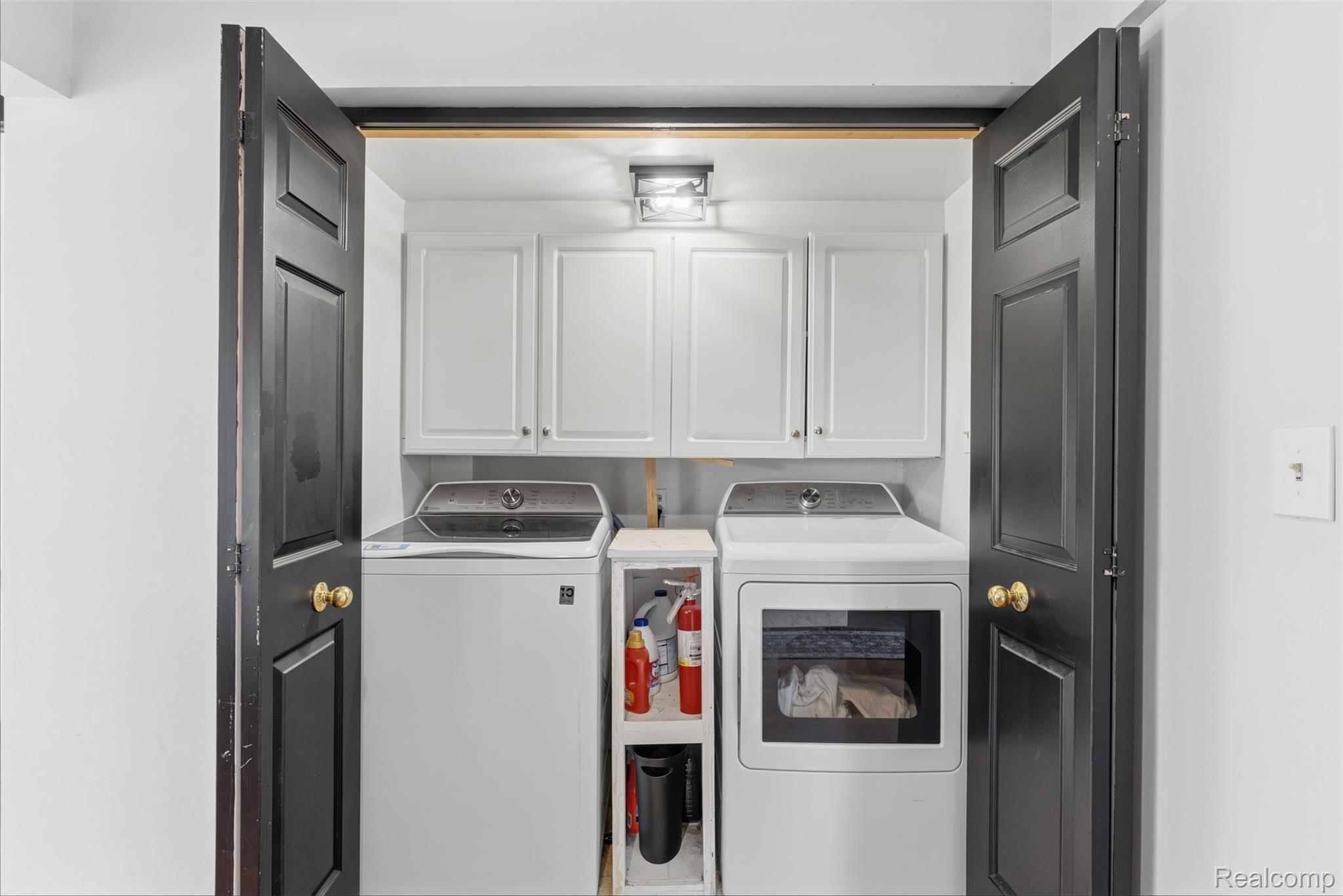 5843 West Dewey Road Owosso, MI 48867 - Photo 18 of 58 Dedicated laundry closet featuring a top-load washing machine and front-load dryer