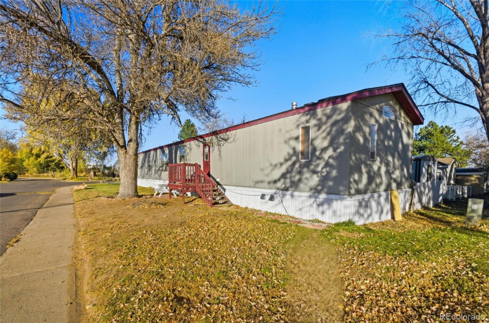 11990 East South Boulder Road Lafayette, CO 80026 - Photo 2 of 20 a view of a yard with wooden fence