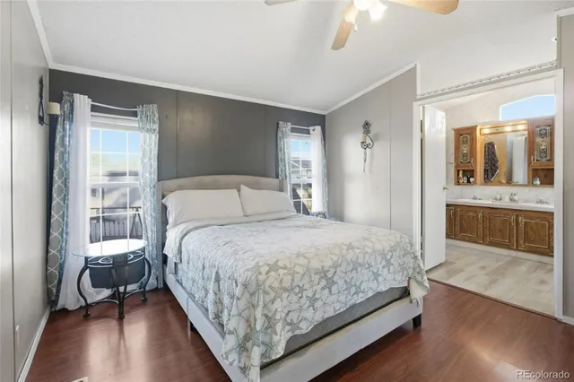 a bedroom with a bed and a view of en suite bathroom