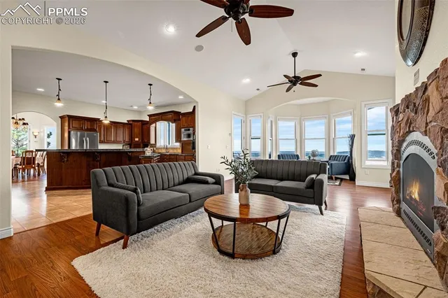 a living room with furniture and a fireplace
