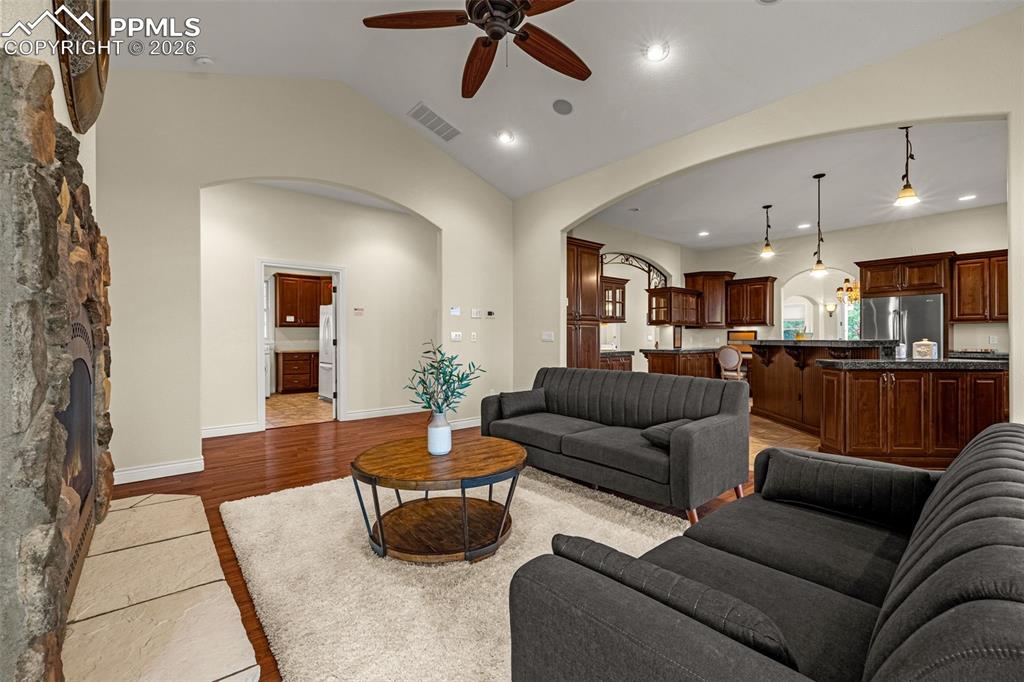 15575 Henry Ride Heights Colorado Springs, CO 80926 - Photo 19 of 46 a living room with furniture and kitchen view