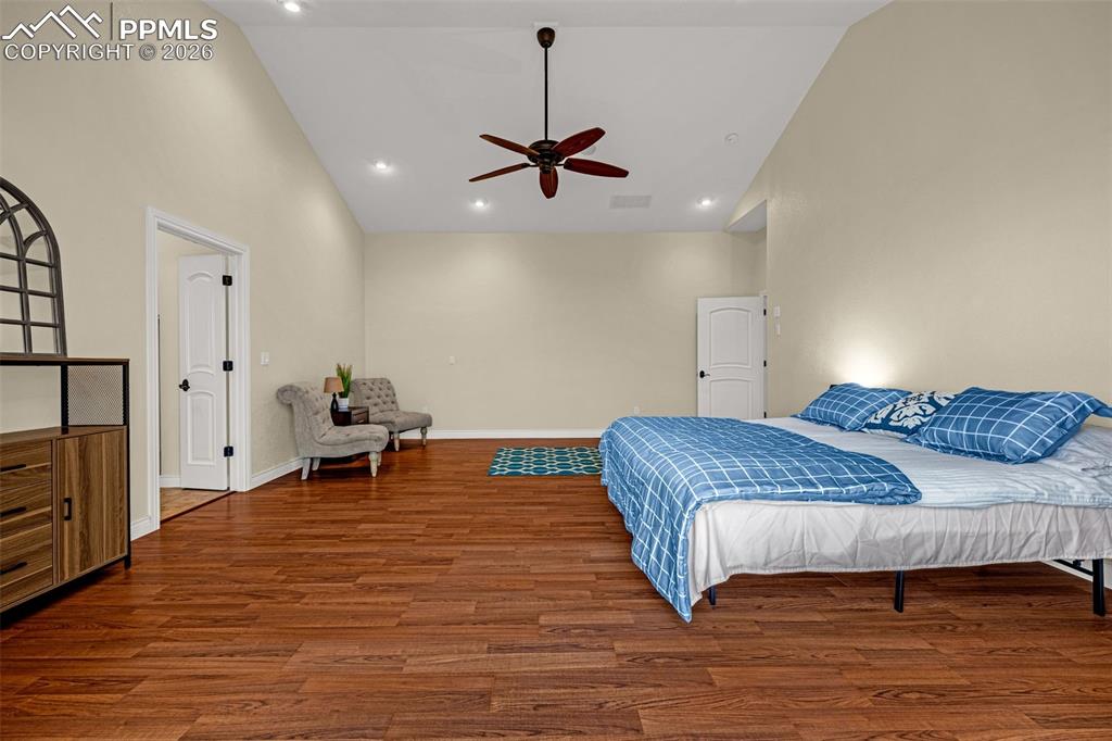 15575 Henry Ride Heights Colorado Springs, CO 80926 - Photo 22 of 46 a bedroom with a bed and furniture