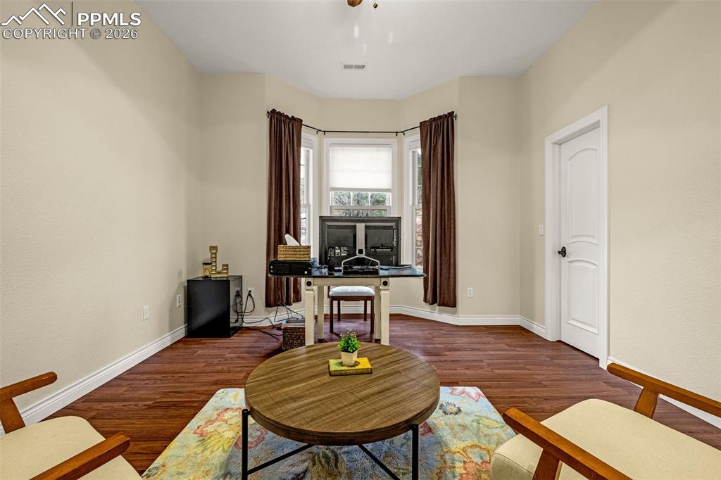 15575 Henry Ride Heights Colorado Springs, CO 80926 - Photo 29 of 46 a living room with furniture and a window
