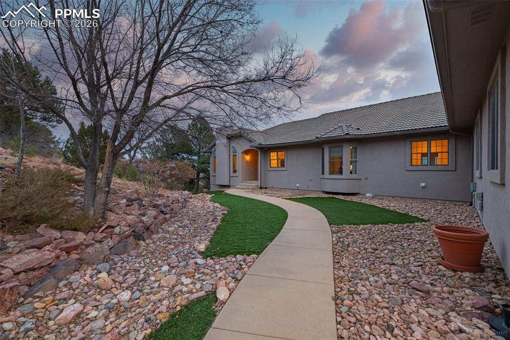 15575 Henry Ride Heights Colorado Springs, CO 80926 - Photo 40 of 46 a front view of a house with garden