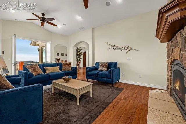 a living room with furniture a rug and a chandelier