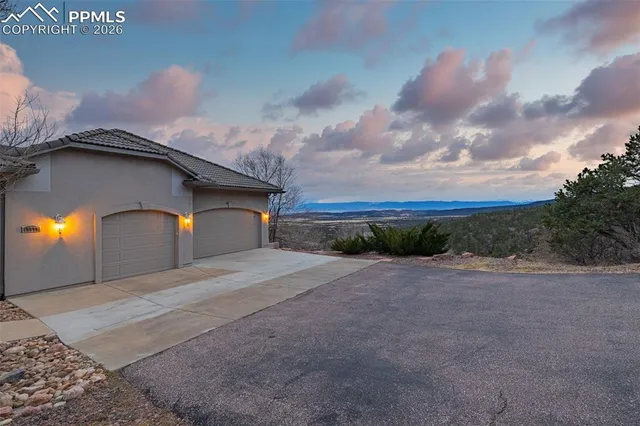a yellow house with yard in front of it