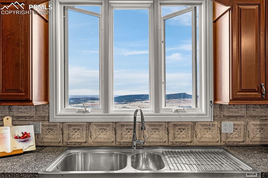 15575 Henry Ride Heights Colorado Springs, CO 80926 - Photo 9 of 46 a kitchen with stainless steel appliances granite countertop a sink and a window