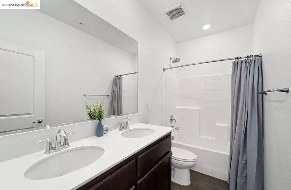 1749 Botticelli Way Lodi, CA 95242 - Photo 12 of 24 a bathroom with a sink toilet and shower
