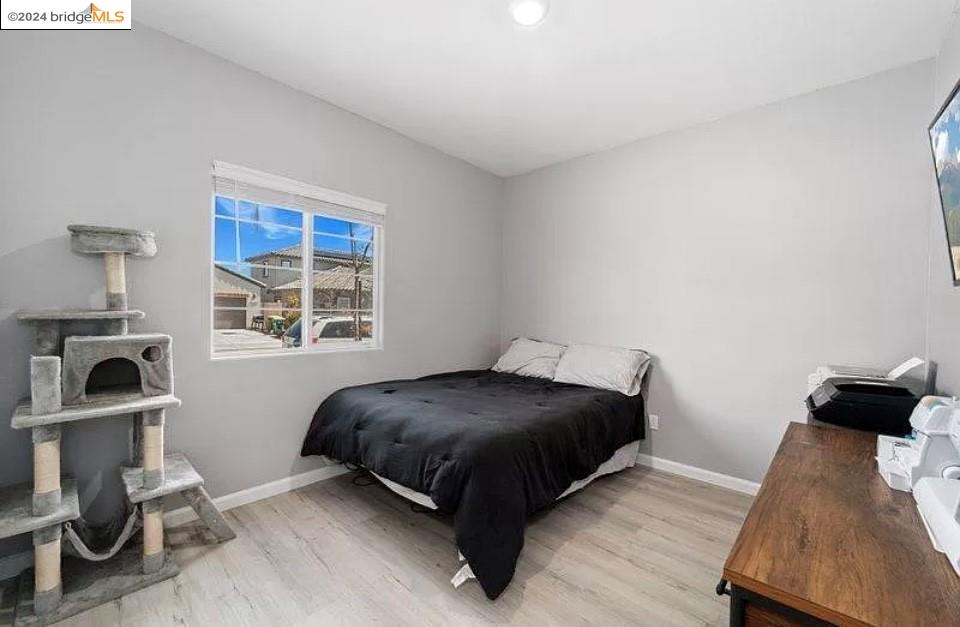 1749 Botticelli Way Lodi, CA 95242 - Photo 15 of 24 a bedroom with a bed and cabinets