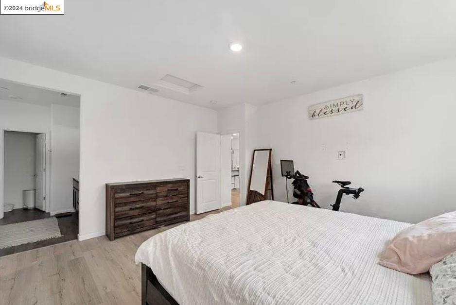 1749 Botticelli Way Lodi, CA 95242 - Photo 19 of 24 a bedroom with a bed and a dresser