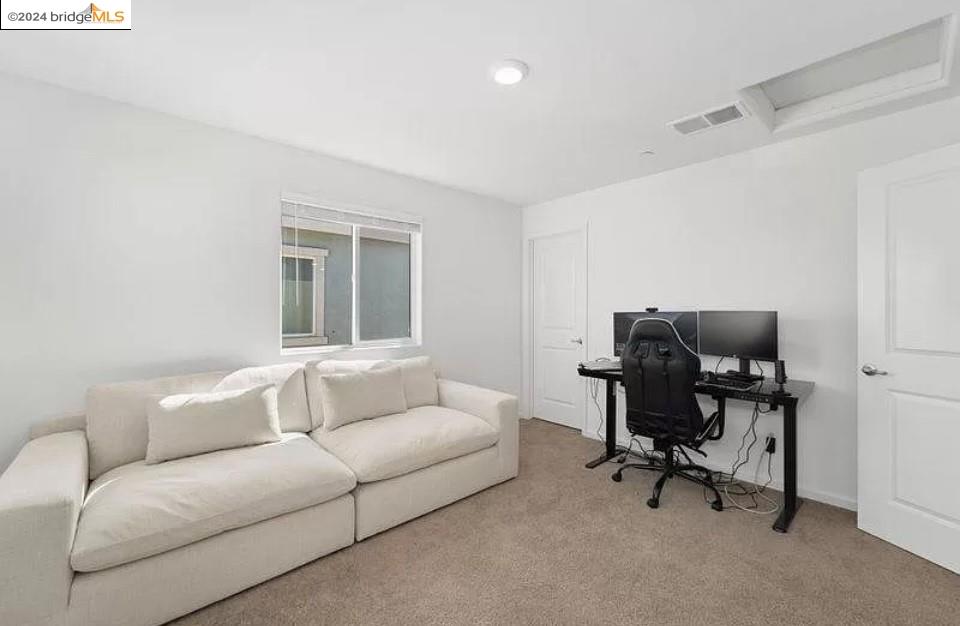 1749 Botticelli Way Lodi, CA 95242 - Photo 20 of 24 a living room with furniture and a window