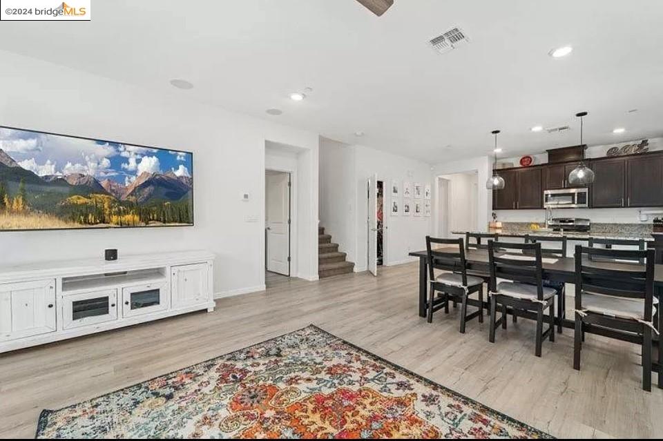 1749 Botticelli Way Lodi, CA 95242 - Photo 5 of 24 a view of a dining room with furniture and wooden floor