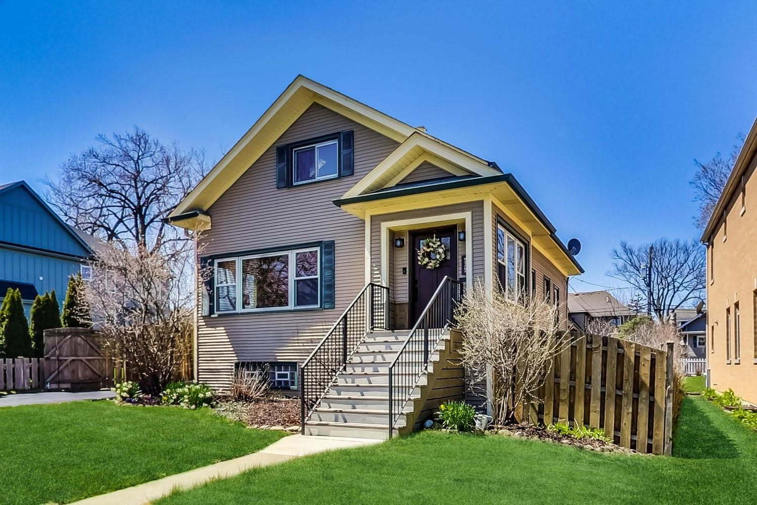 272 North Willow Road Elmhurst, IL 60126 - Photo 1 of 38 a front view of a house with a garden