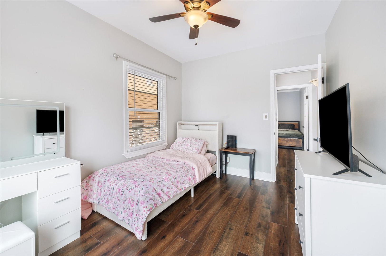 272 North Willow Road Elmhurst, IL 60126 - Photo 18 of 38 a bedroom with a bed and a flat screen tv
