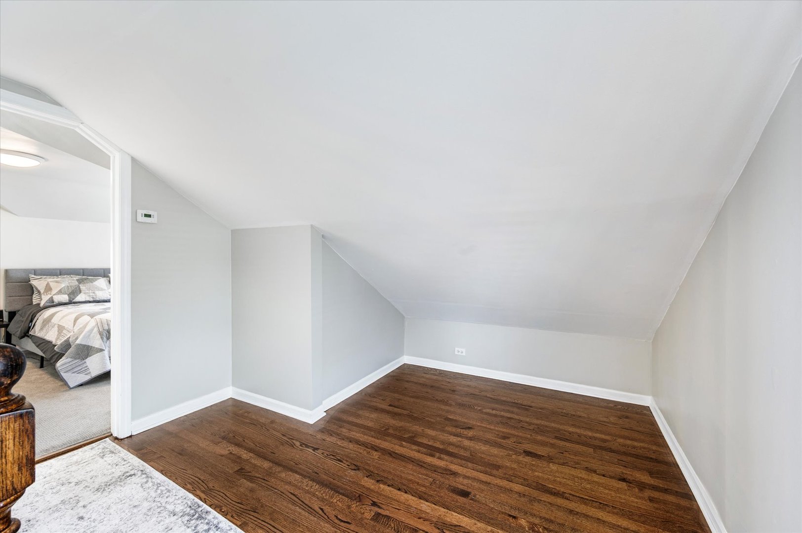 272 North Willow Road Elmhurst, IL 60126 - Photo 20 of 38 a view of a livingroom with wooden floor and bedroom