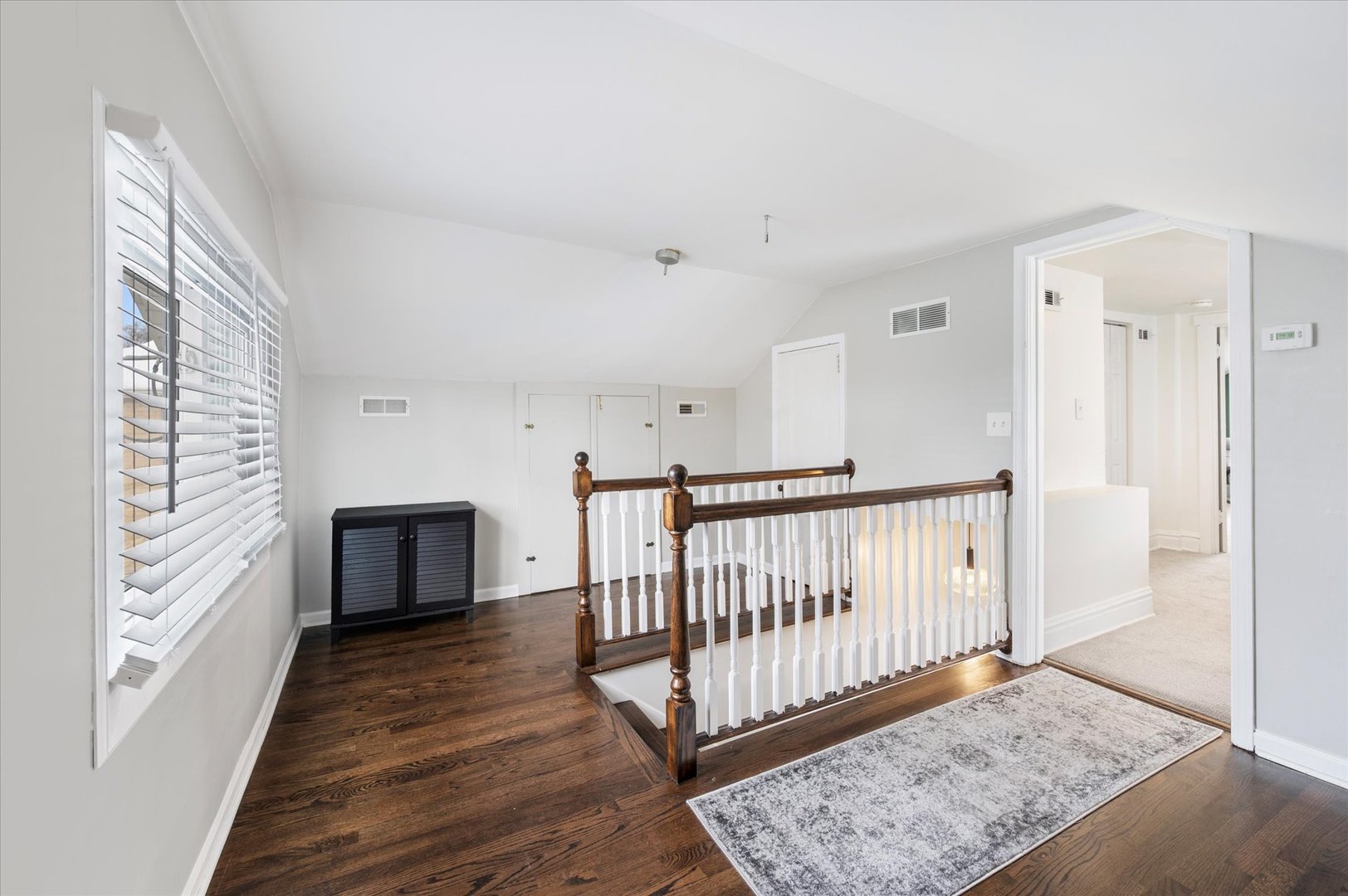 272 North Willow Road Elmhurst, IL 60126 - Photo 21 of 38 a view of a hallway with wooden floor and windows