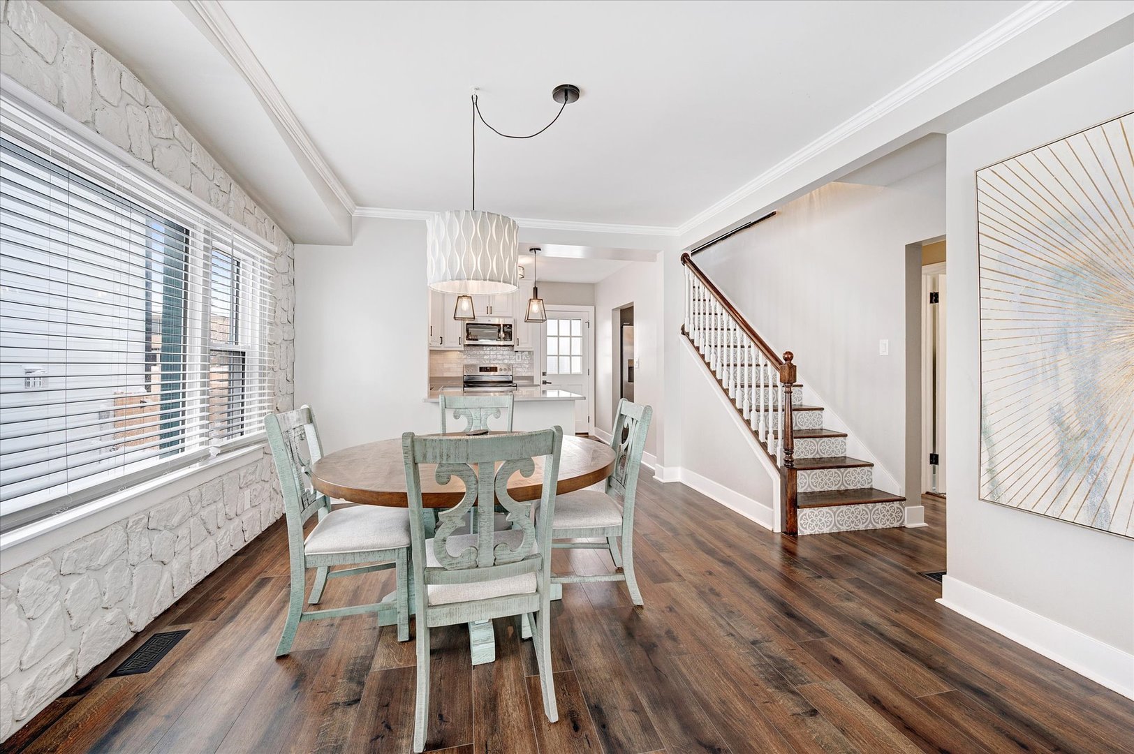 272 North Willow Road Elmhurst, IL 60126 - Photo 9 of 38 a dining room with wooden floor a chandelier a wooden table and chairs