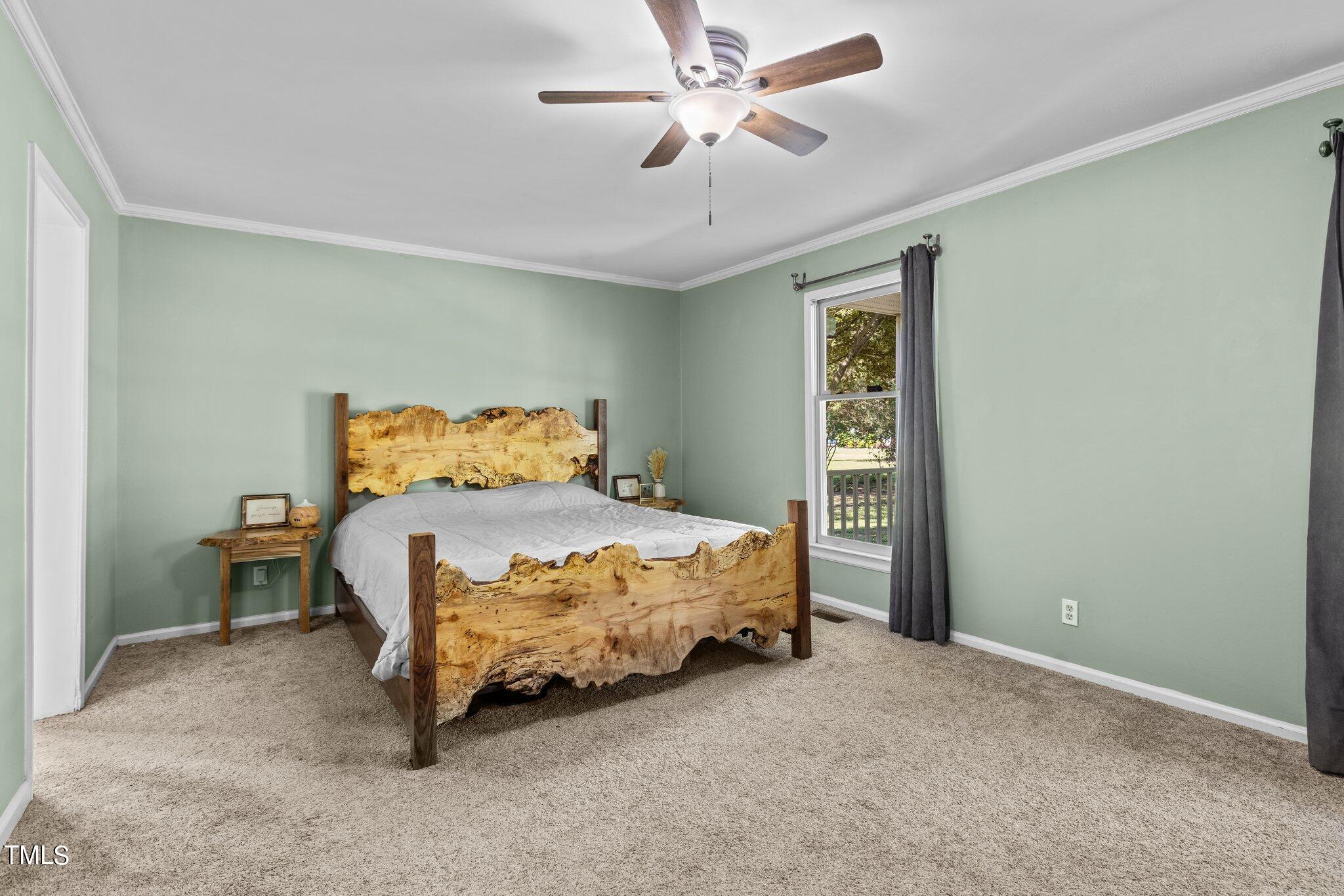 5321 Holland Church Road Raleigh, NC 27603 - Photo 20 of 43 a bedroom with a bed and window