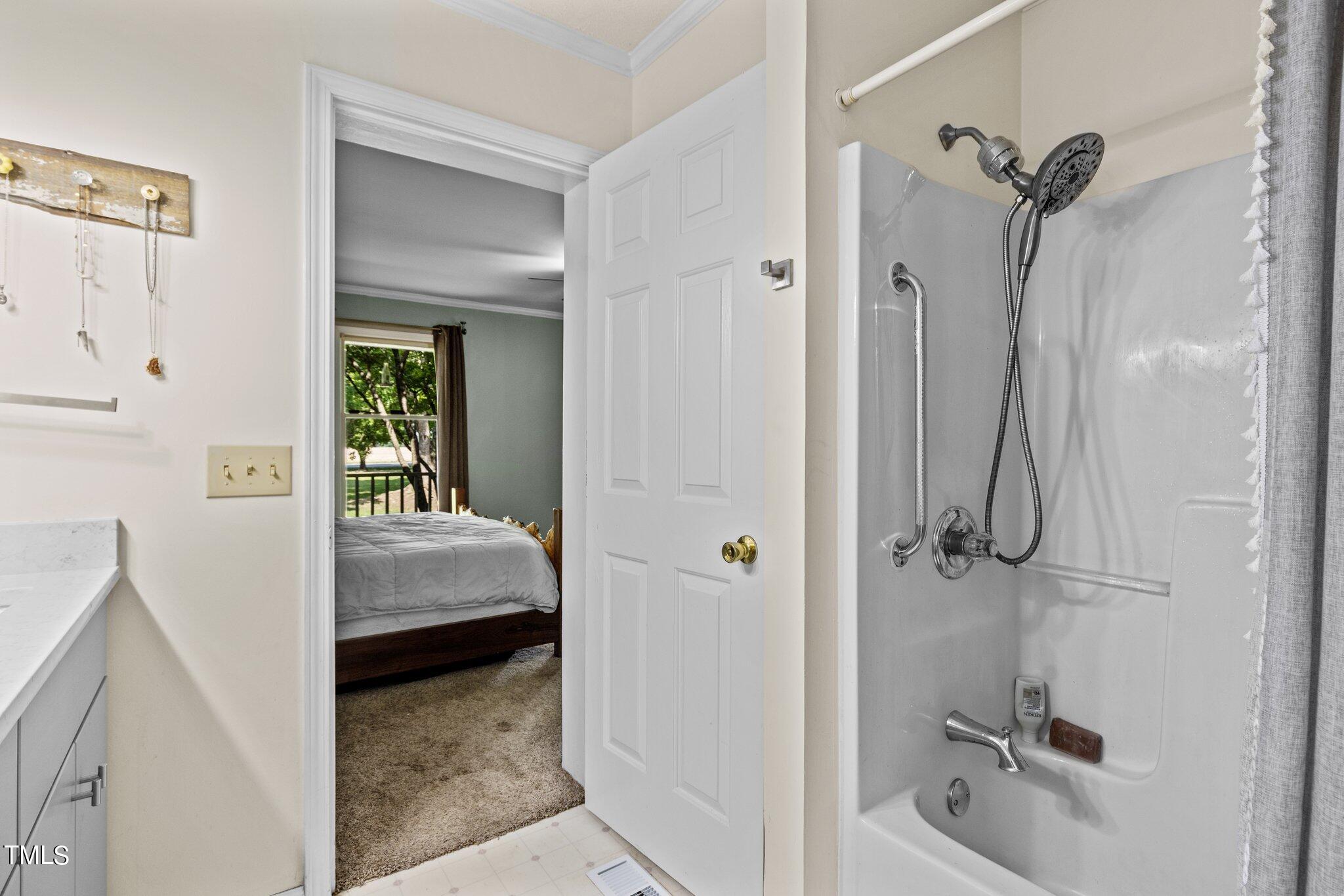 5321 Holland Church Road Raleigh, NC 27603 - Photo 23 of 43 a bathroom with a tub and shower