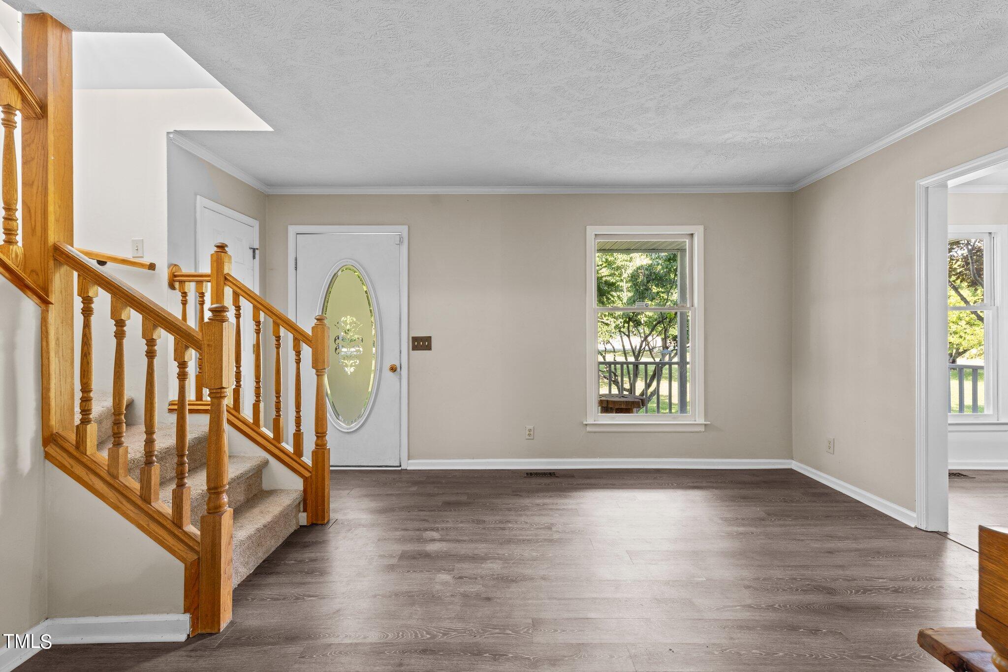 5321 Holland Church Road Raleigh, NC 27603 - Photo 4 of 43 a view of an entryway with wooden floor