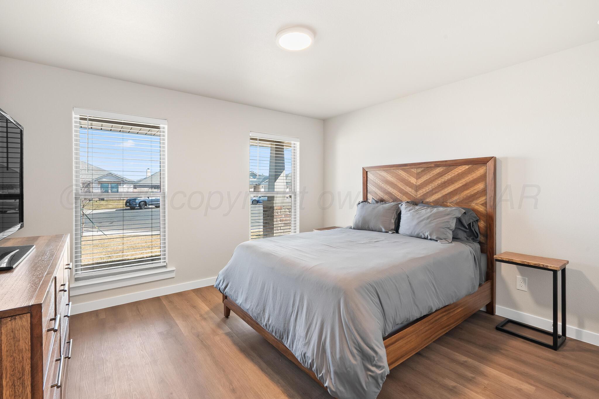 7500 Castleman Road Amarillo, TX 79119 - Photo 18 of 20 a bedroom with a bed and window