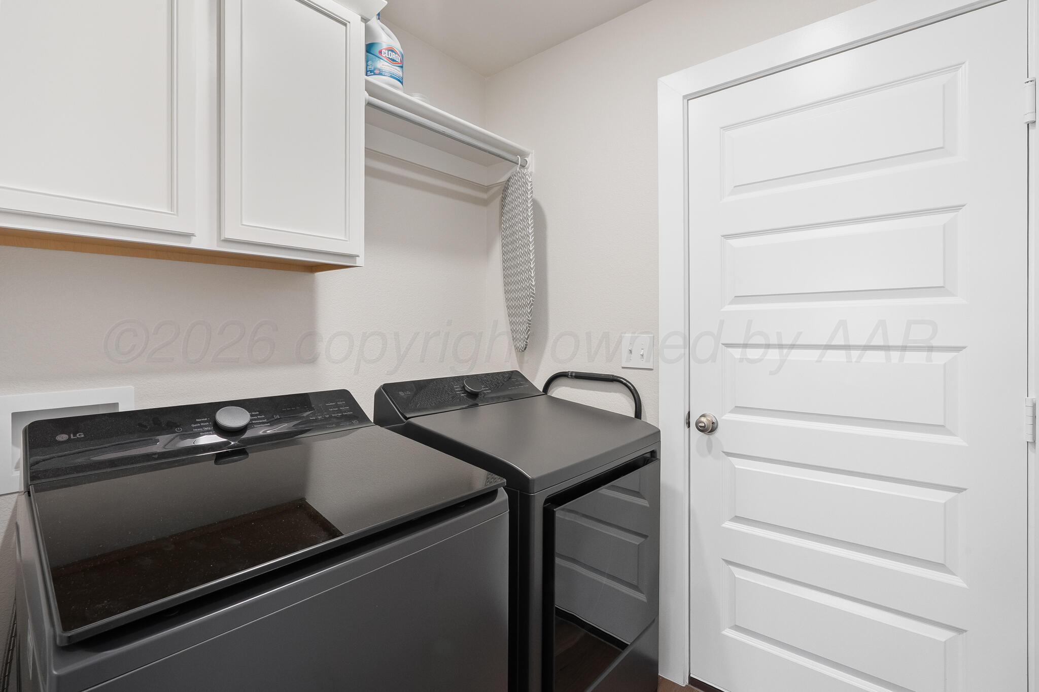 7500 Castleman Road Amarillo, TX 79119 - Photo 19 of 20 a utility room with dryer and washer