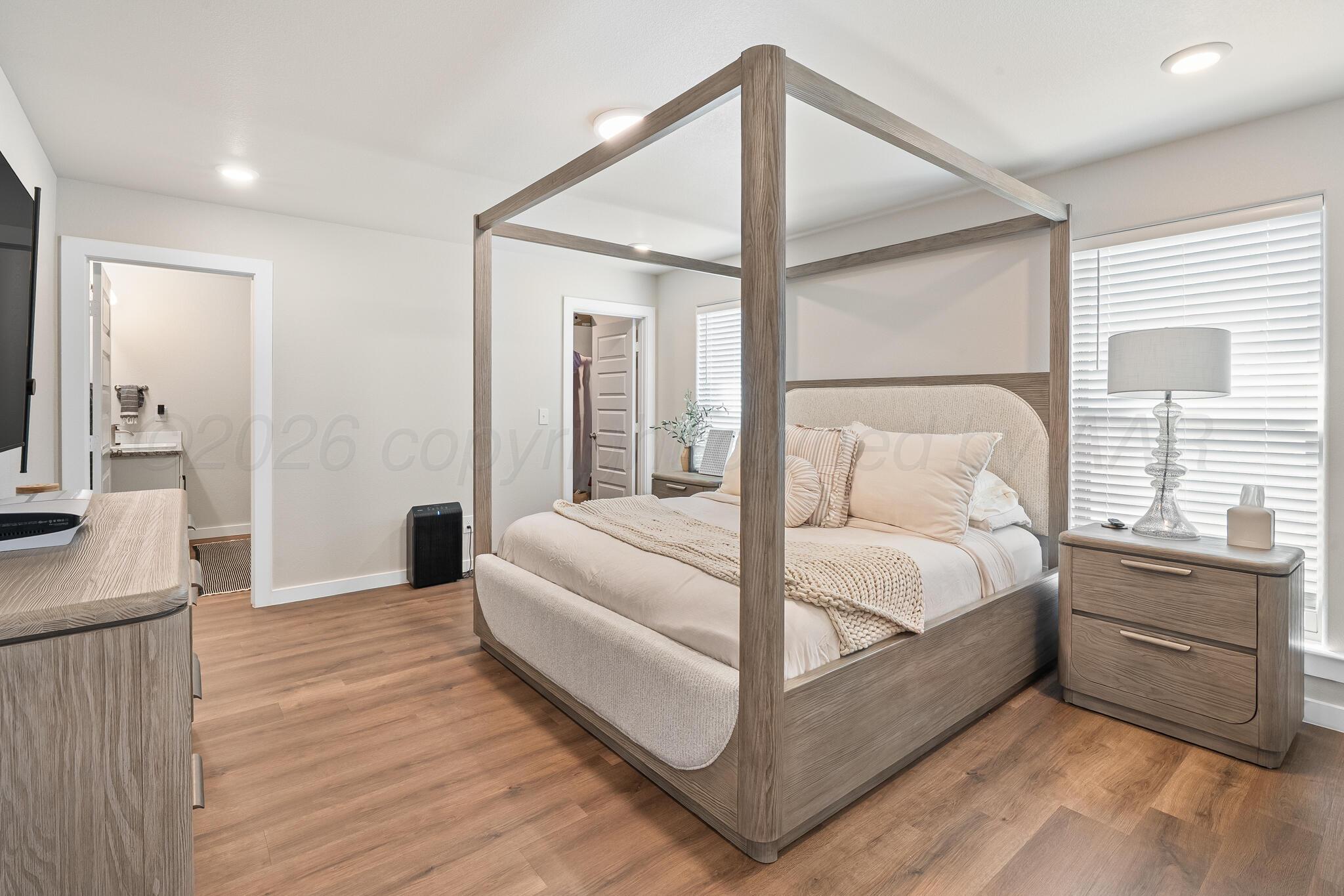 7500 Castleman Road Amarillo, TX 79119 - Photo 10 of 20 a bedroom with a bed and a large window