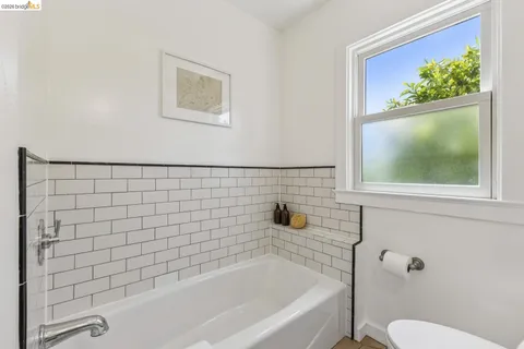 a bathroom with a bathtub and a toilet