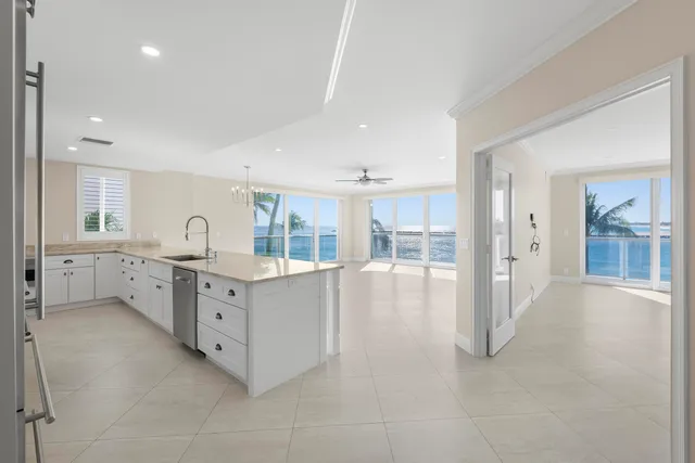 a kitchen with granite countertop a sink and a counter top space