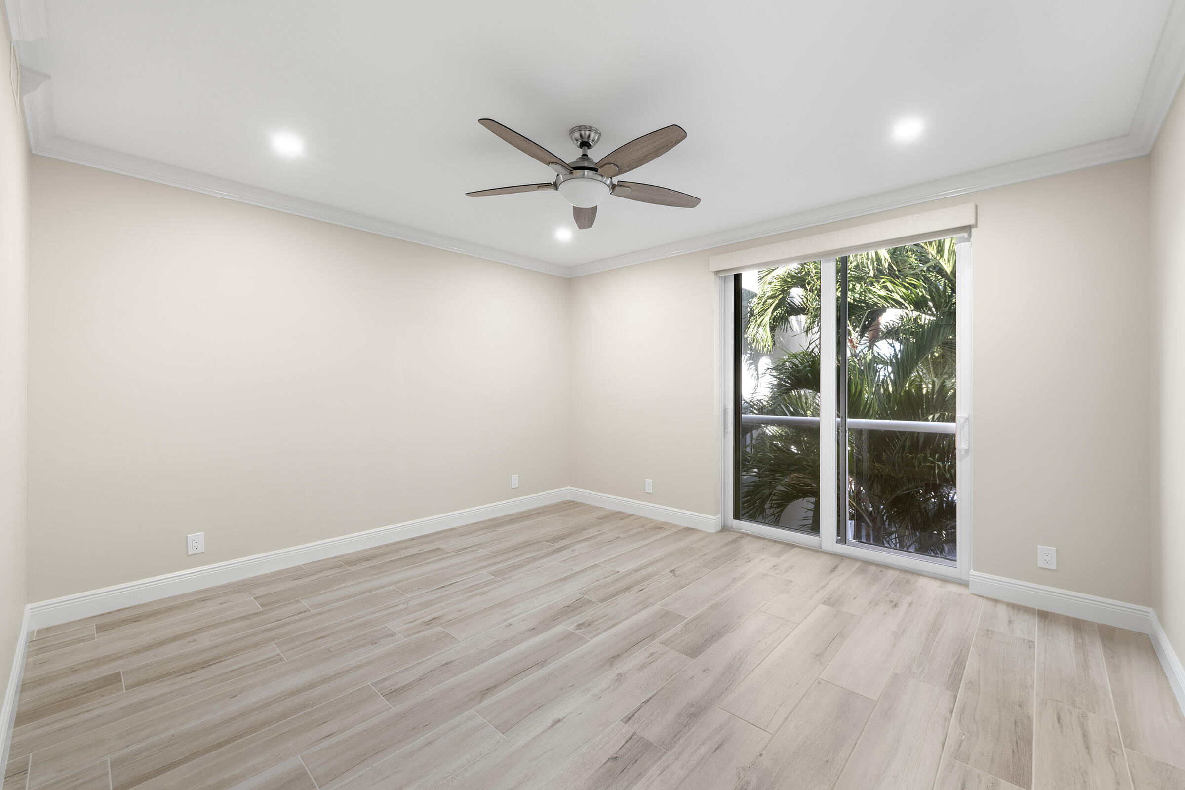 140 Inlet Way, Unit 312 Palm Beach Shores, FL 33404 - Photo 30 of 59 an empty room with wooden floor and windows