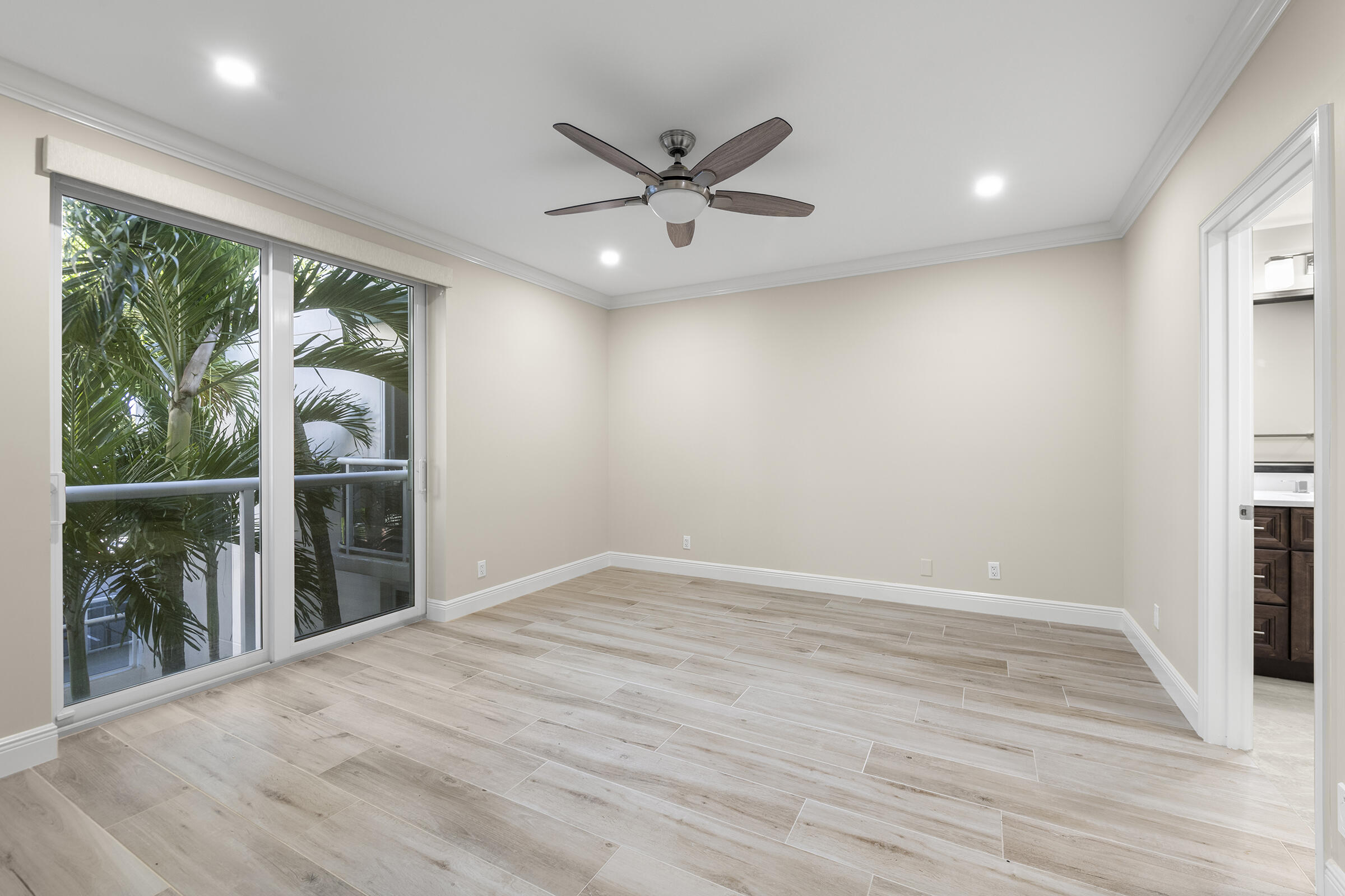 140 Inlet Way, Unit 312 Palm Beach Shores, FL 33404 - Photo 31 of 59 wooden floor in an empty room with a window