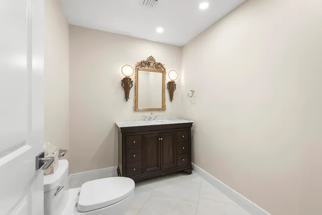 a bathroom with a shower curtain and a sink