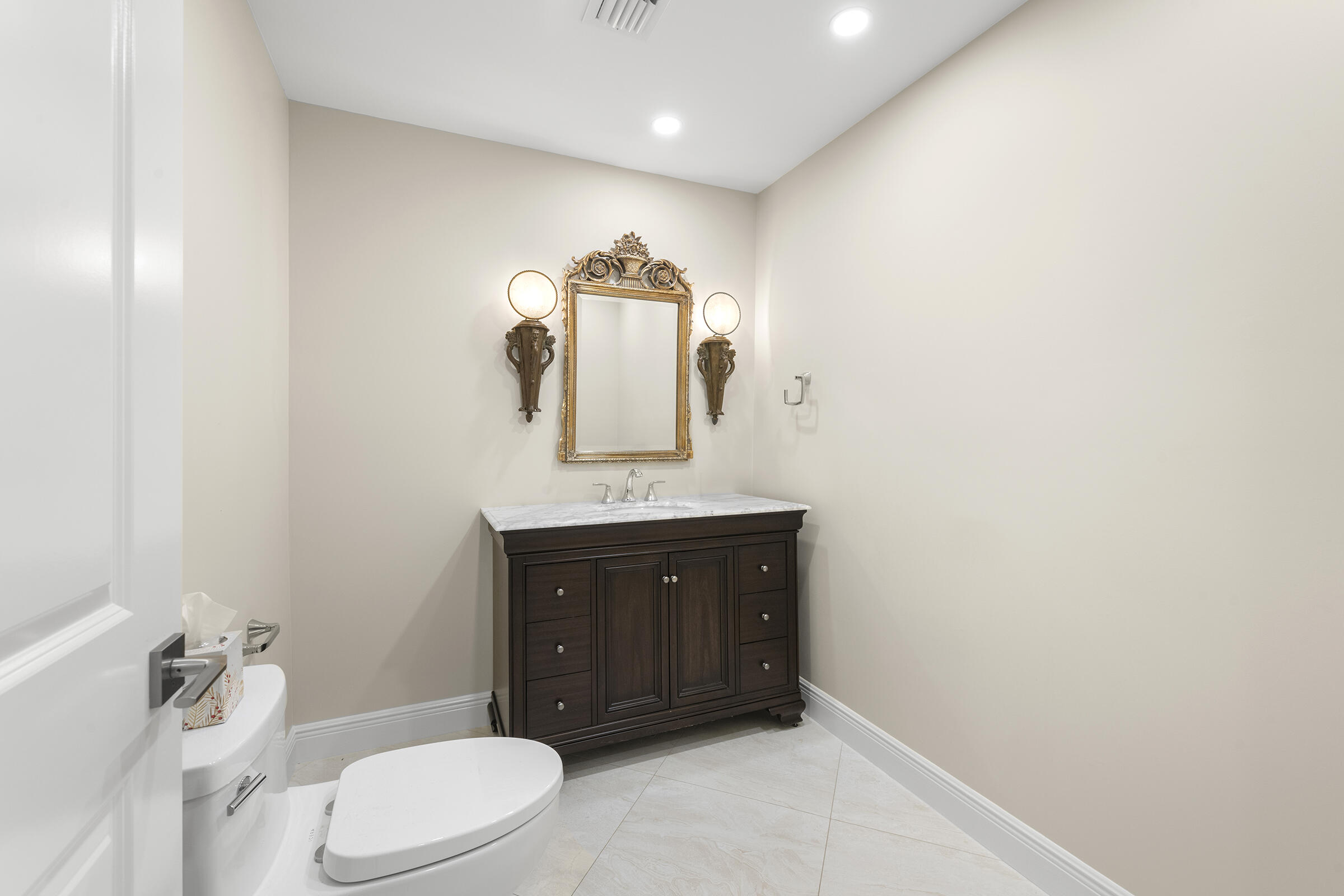 140 Inlet Way, Unit 312 Palm Beach Shores, FL 33404 - Photo 33 of 59 a bathroom with a sink vanity mirror and toilet