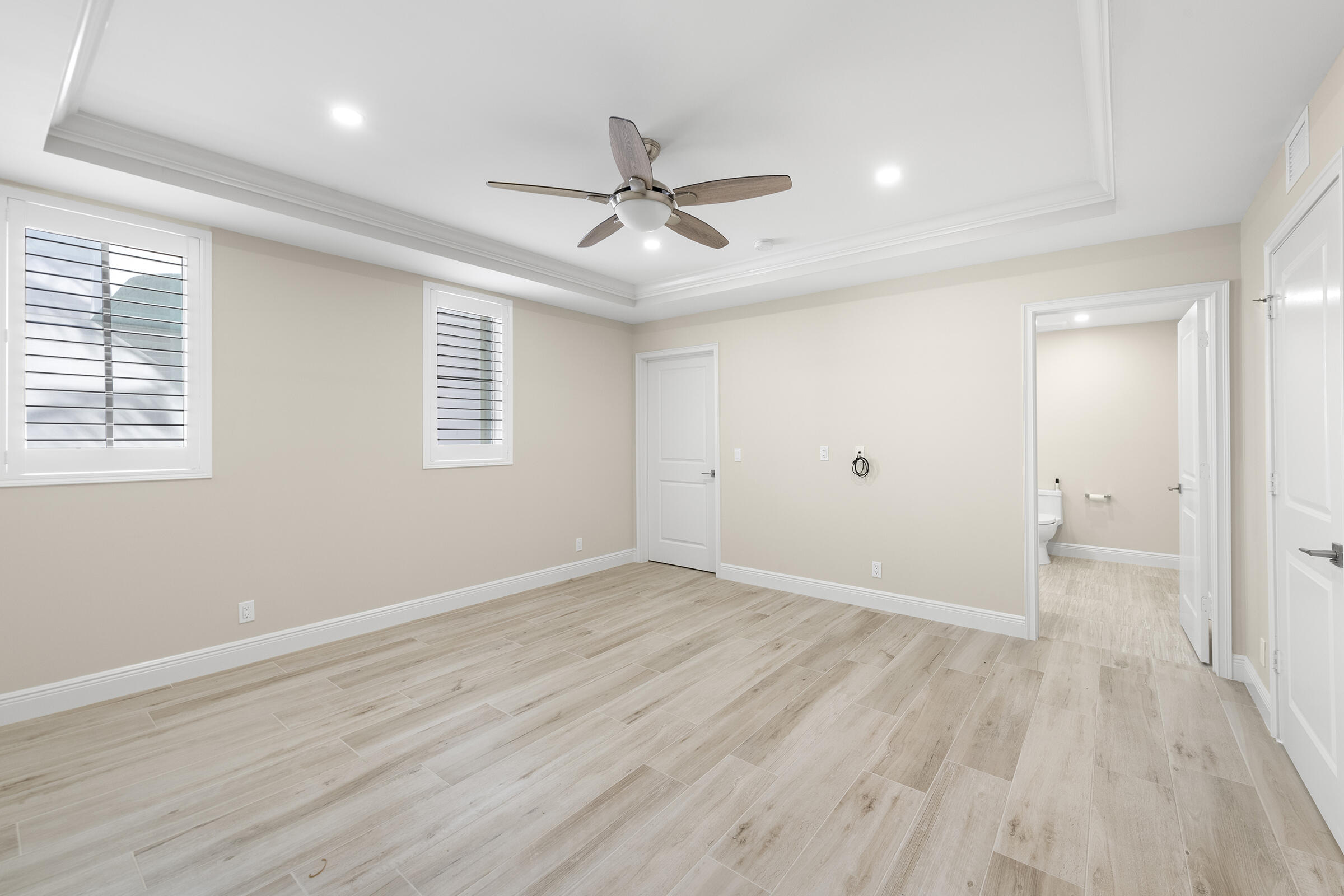 140 Inlet Way, Unit 312 Palm Beach Shores, FL 33404 - Photo 39 of 59 wooden floor in an empty room with a window