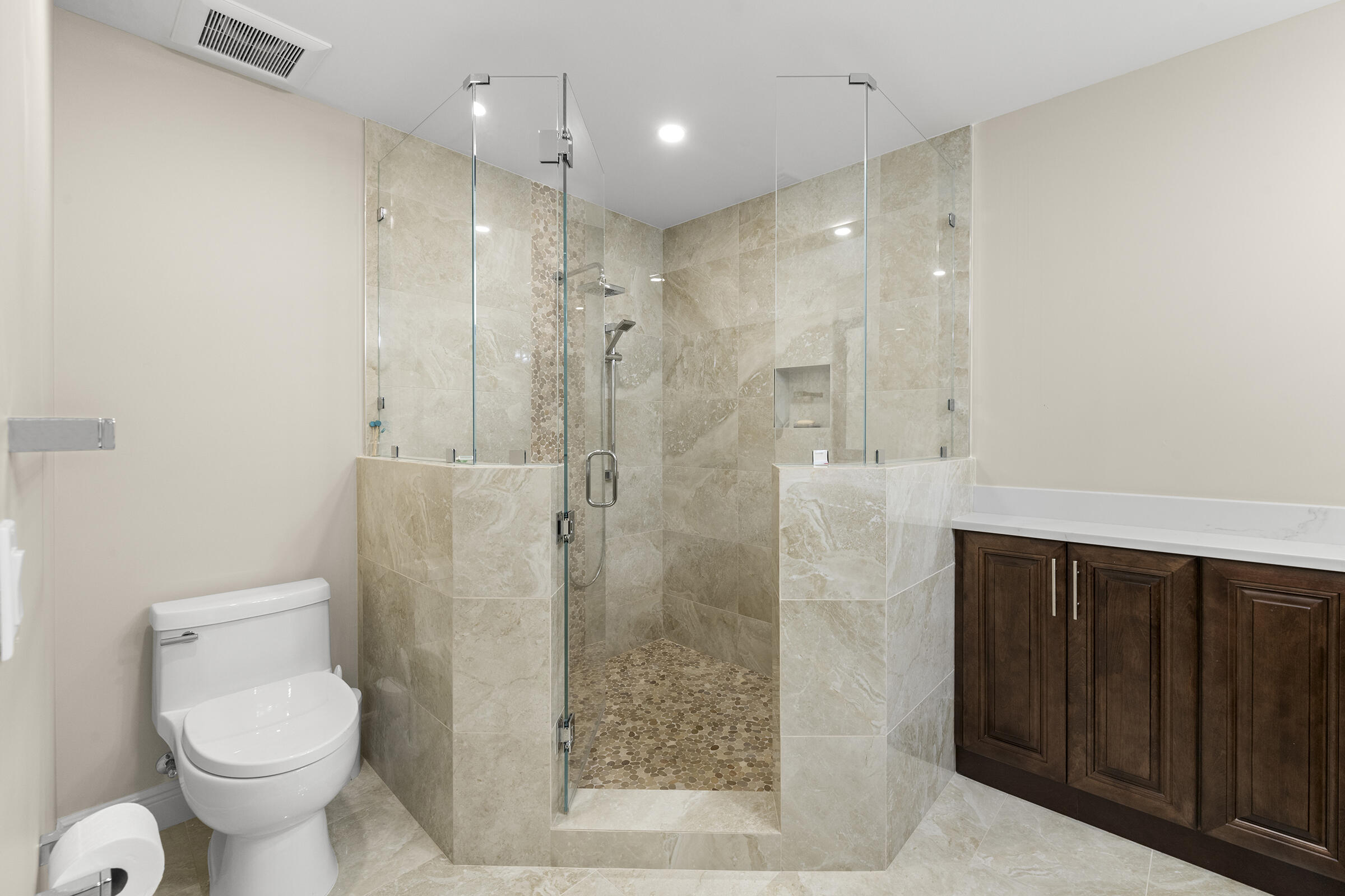 140 Inlet Way, Unit 312 Palm Beach Shores, FL 33404 - Photo 40 of 59 a bathroom with a shower toilet and sink