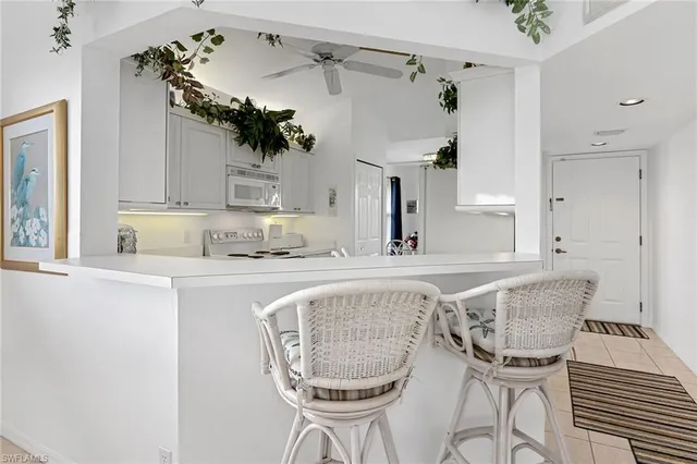 a kitchen with a table and chairs
