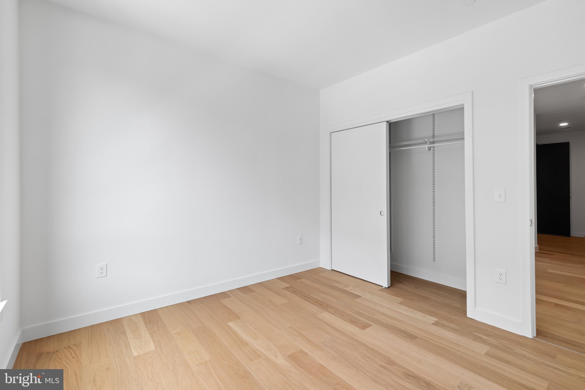 7175 12th Street Northwest, Unit 513 Washington, DC 20012 - Photo 4 of 31 a view of empty room with wooden floor