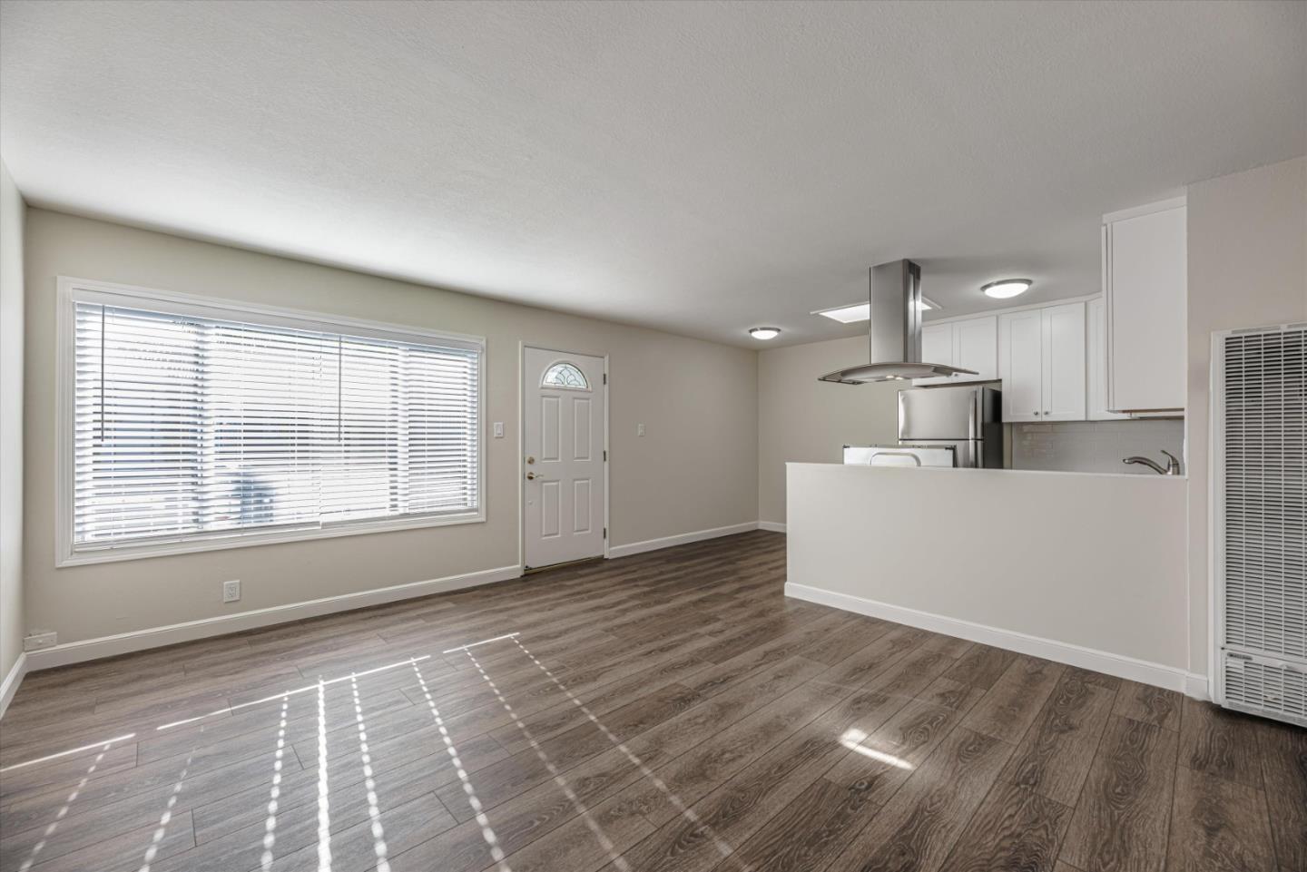 424 Richmond Drive Millbrae, CA 94030 - Photo 11 of 22 a view of a kitchen with an empty space and a window