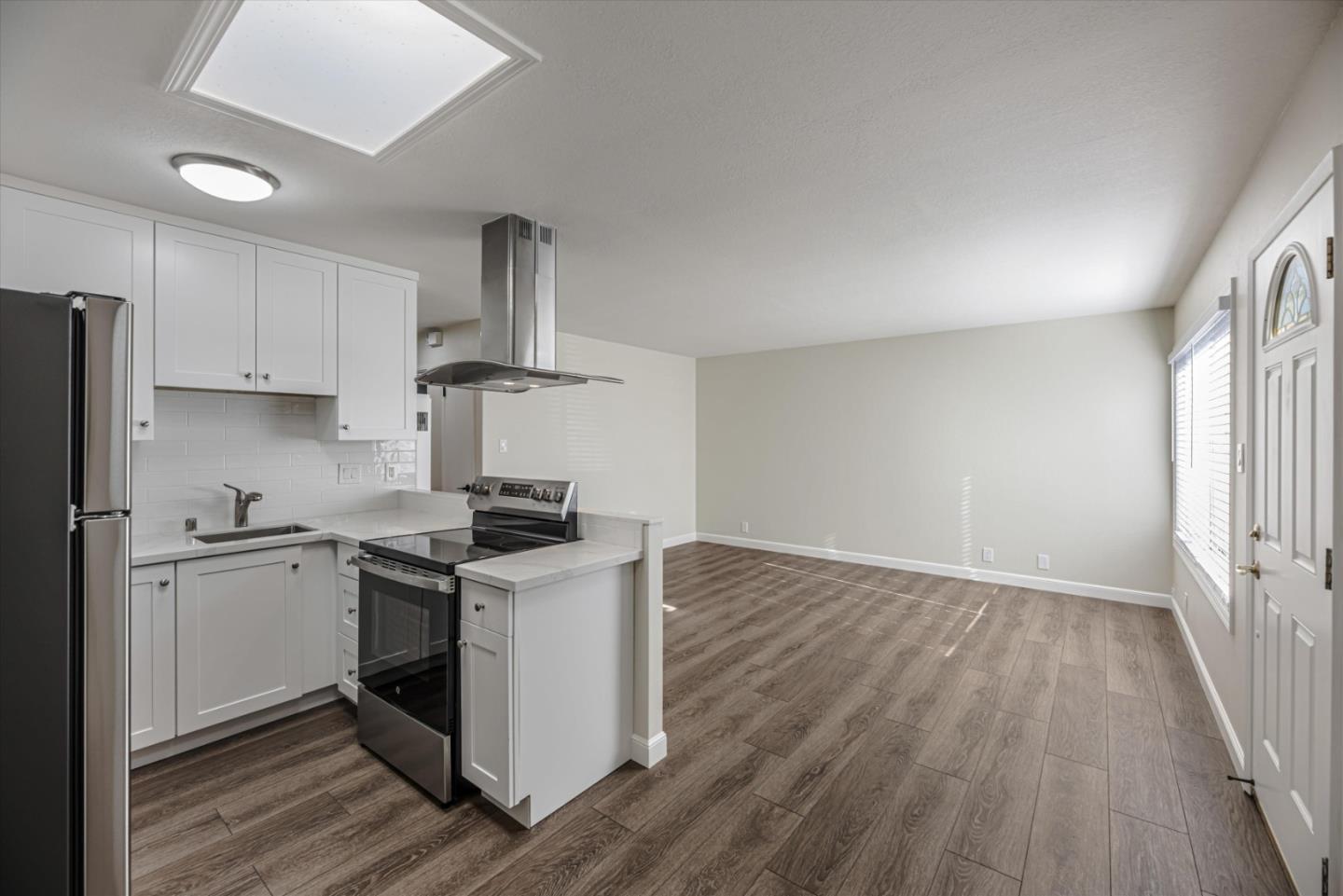 424 Richmond Drive Millbrae, CA 94030 - Photo 12 of 22 a kitchen with a stove top oven and cabinets