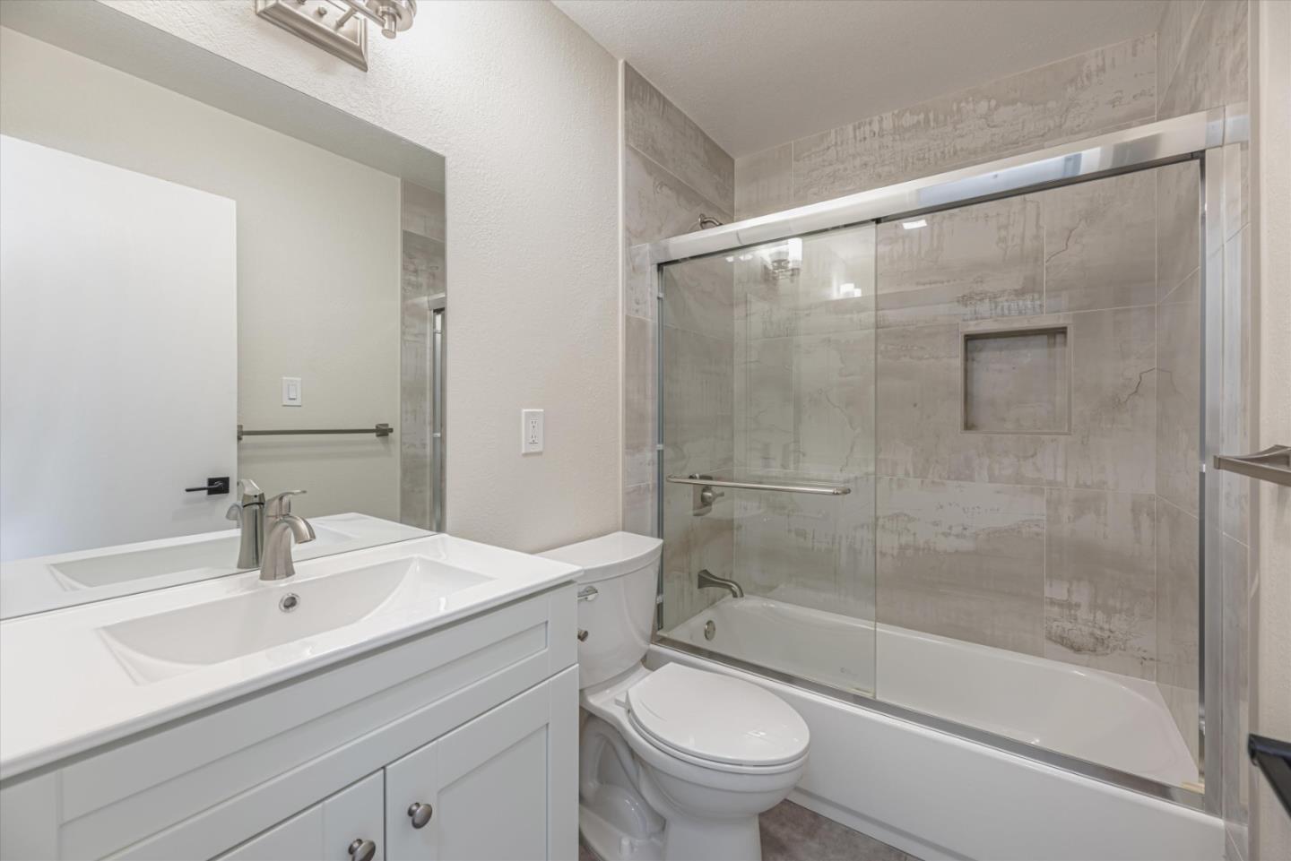 424 Richmond Drive Millbrae, CA 94030 - Photo 18 of 22 a bathroom with a sink mirror toilet and bathtub